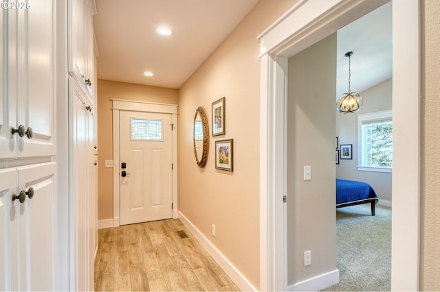 1329 NW Horn Ave, Pendleton, OR 97801 - entryway with baseboards, light wood finished floors, recessed lighting, and a chandelier