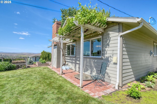 1329 NW Horn Ave, Pendleton, OR 97801 - view of property exterior with a lawn, a pergola, a chimney, and a patio area
