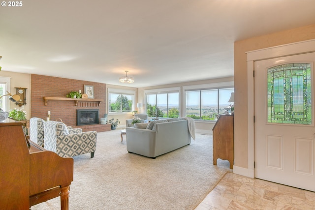 1329 NW Horn Ave, Pendleton, OR 97801 - living room featuring a fireplace, a chandelier, and carpet