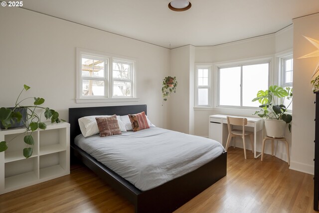 bedroom with light wood-type flooring