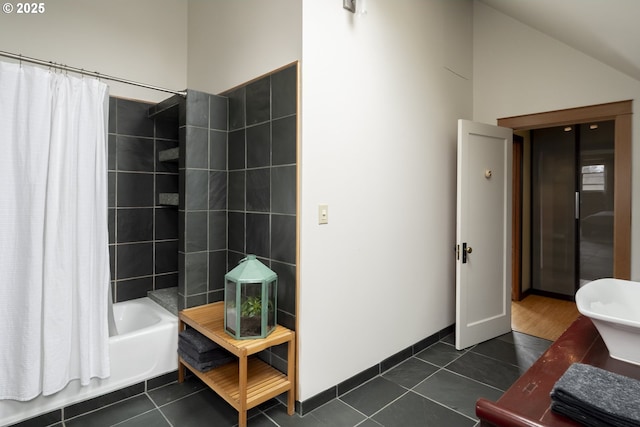 bathroom with shower / tub combo with curtain, vaulted ceiling, and tile patterned floors