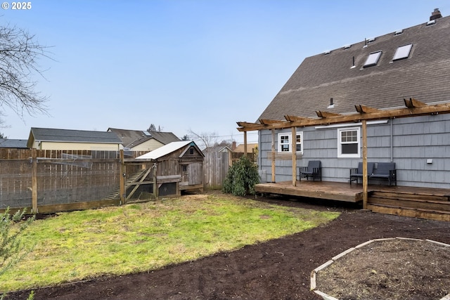 view of yard with an outbuilding and a deck