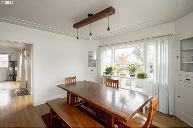 dining area with hardwood / wood-style flooring