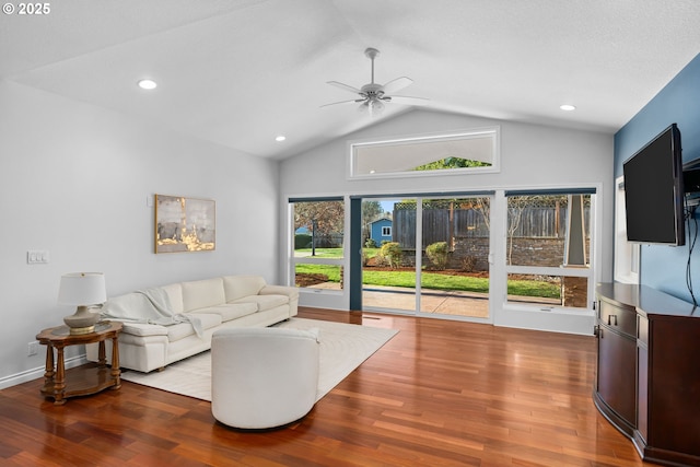 living area featuring baseboards, ceiling fan, recessed lighting, wood finished floors, and lofted ceiling