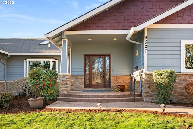 entrance to property with stone siding