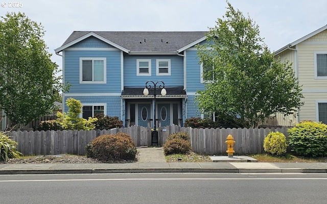 view of front of house with roof with shingles