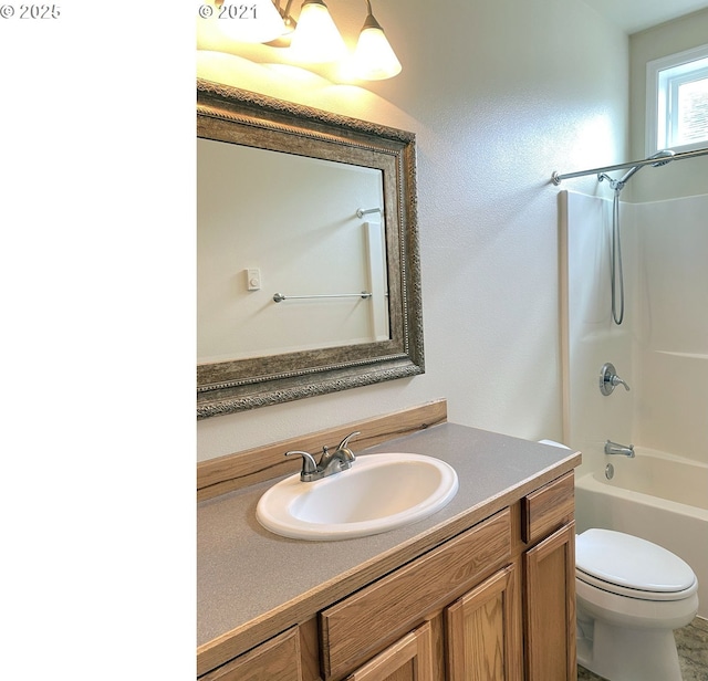 full bathroom featuring toilet,  shower combination, and vanity