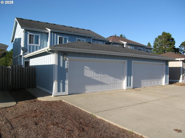 garage with fence