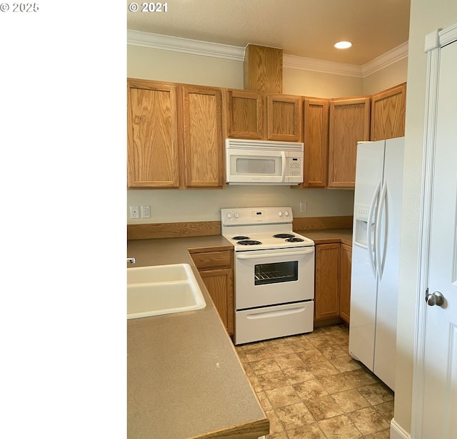 kitchen featuring white appliances, a sink, ornamental molding, recessed lighting, and light countertops