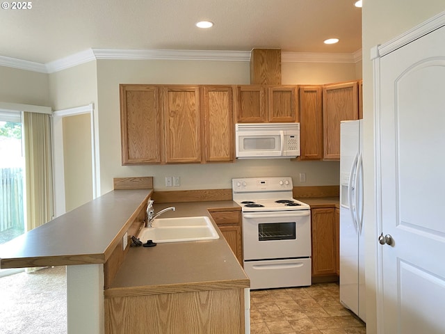 kitchen featuring white appliances, a sink, a peninsula, ornamental molding, and recessed lighting