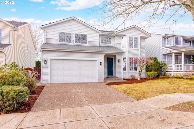 view of front property featuring a garage and a front lawn