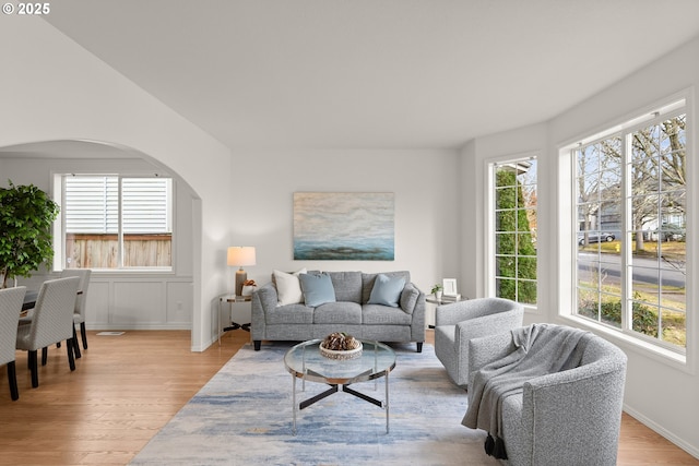 living room with plenty of natural light and light hardwood / wood-style floors