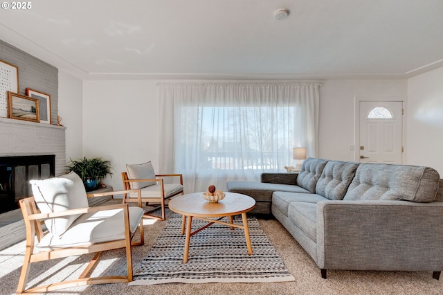 living area featuring a brick fireplace