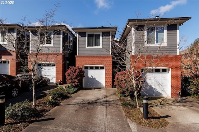 view of front facade with a garage, brick siding, and driveway