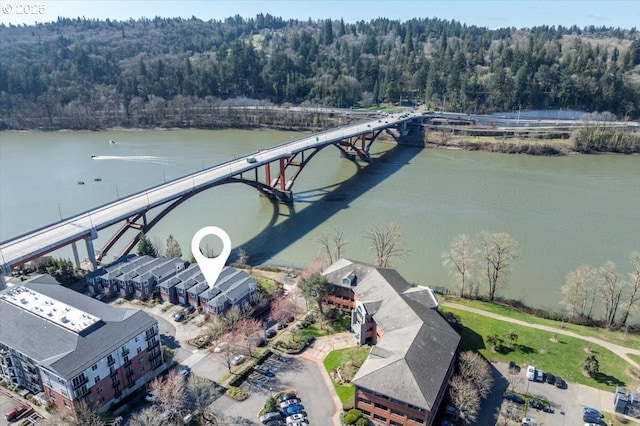 bird's eye view featuring a water view and a view of trees