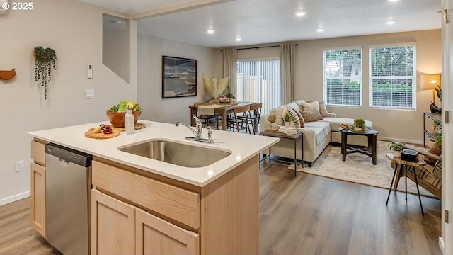 6161 SE 15th St, Gresham, OR 97080 - kitchen with stainless steel dishwasher, light brown cabinetry, light countertops, light wood-style floors, and an island with sink