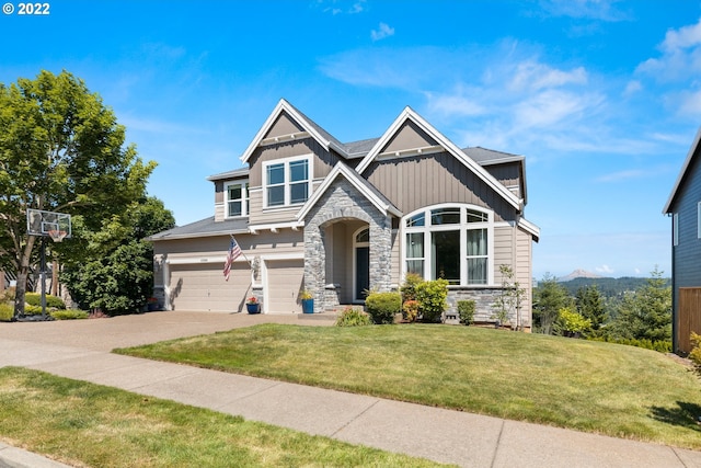 craftsman inspired home with an attached garage, board and batten siding, a front yard, and stone siding