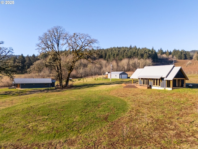 view of yard with a rural view