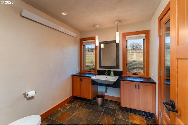 bathroom featuring sink and toilet