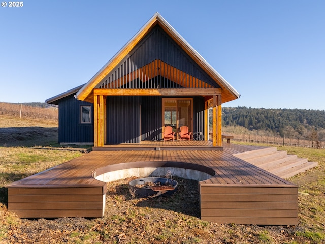 rear view of property with a deck