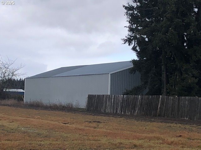 view of side of home with an outbuilding and an outdoor structure