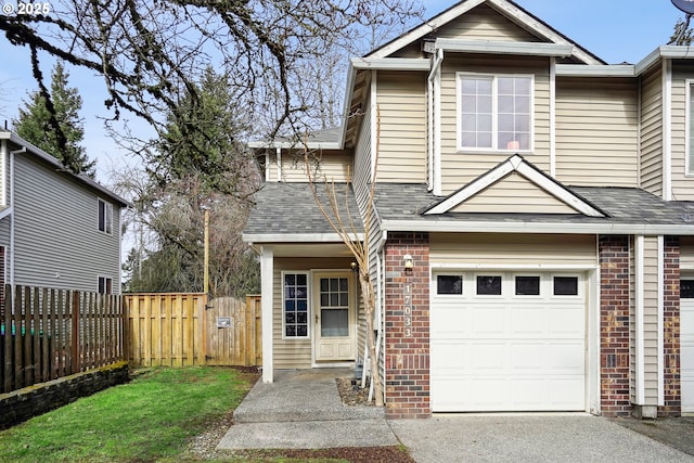 view of front of home with a garage, brick siding, a shingled roof, and fence