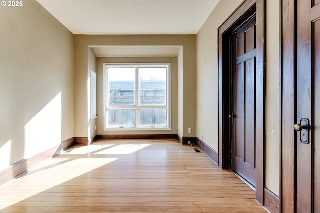 doorway with light hardwood / wood-style flooring