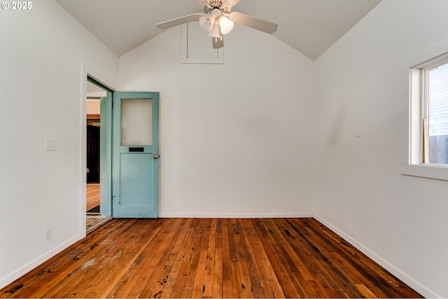 spare room with lofted ceiling, dark hardwood / wood-style floors, and ceiling fan