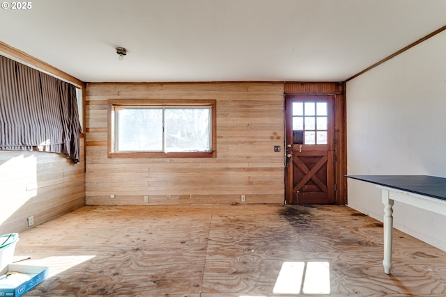 entrance foyer featuring wood walls