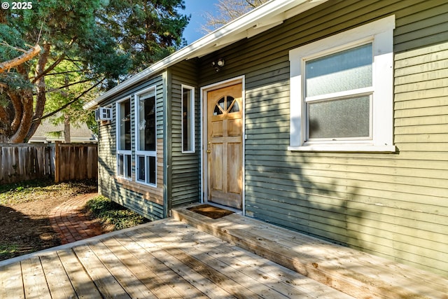 view of exterior entry featuring a deck