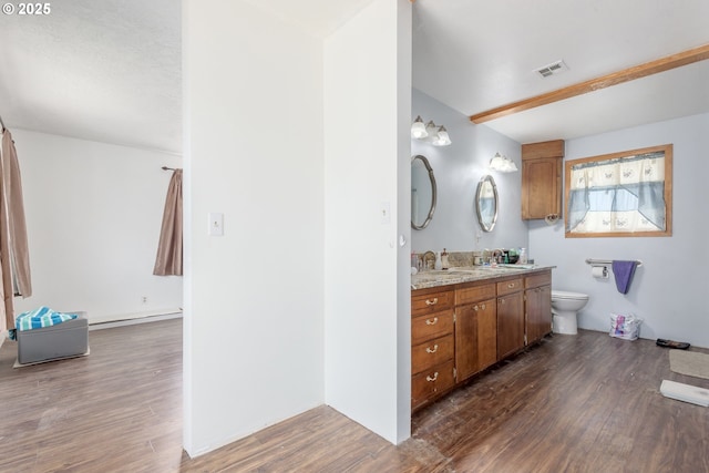 1453 N St, Springfield, OR 97477 - full bath with double vanity, wood finished floors, and toilet
