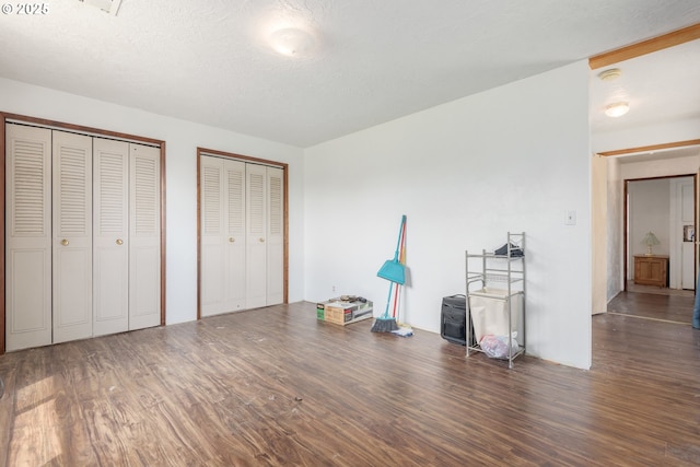1453 N St, Springfield, OR 97477 - unfurnished bedroom featuring wood finished floors and multiple closets