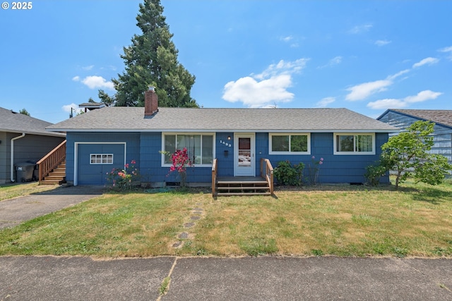 1453 N St, Springfield, OR 97477 - ranch-style house featuring an attached garage, a front lawn, a chimney, asphalt driveway, and crawl space
