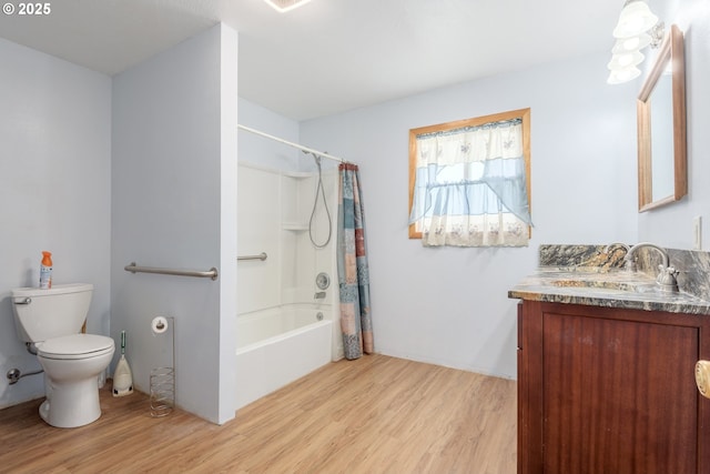 1453 N St, Springfield, OR 97477 - bathroom featuring wood finished floors, toilet, vanity, and shower / bath combo with shower curtain
