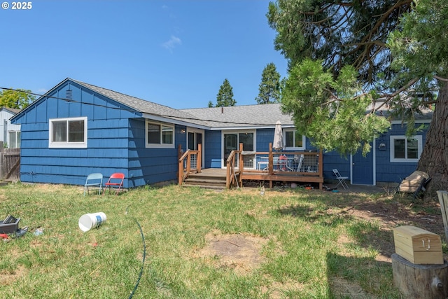 1453 N St, Springfield, OR 97477 - rear view of house with a wooden deck and a lawn