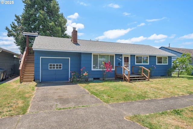 1453 N St, Springfield, OR 97477 - ranch-style house with a garage, a chimney, driveway, and a front lawn