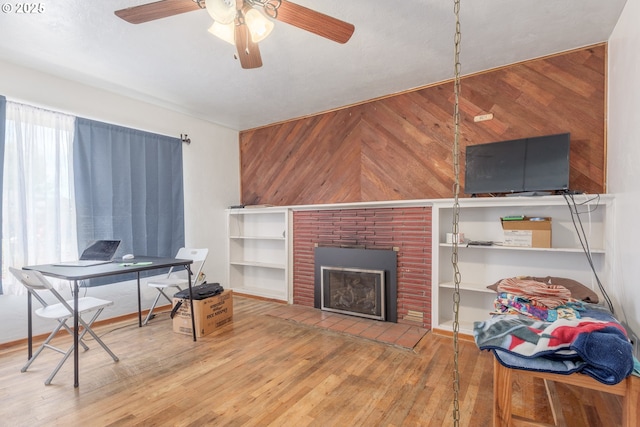 1453 N St, Springfield, OR 97477 - office with wooden walls, wood finished floors, a ceiling fan, and a fireplace