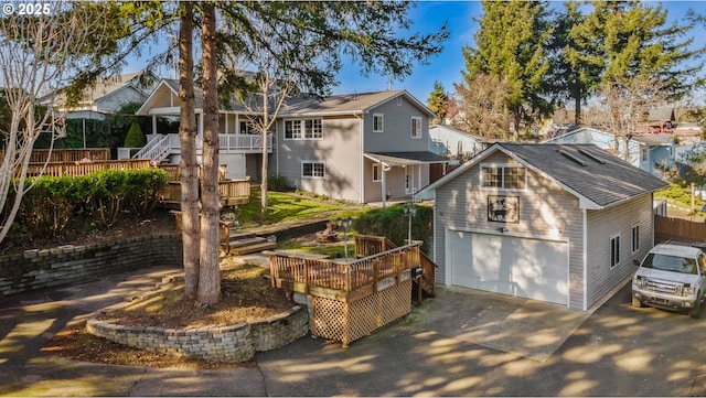 view of front of house with a balcony, a wooden deck, and a garage