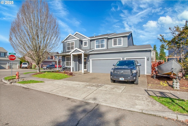 traditional home with board and batten siding, driveway, and a garage