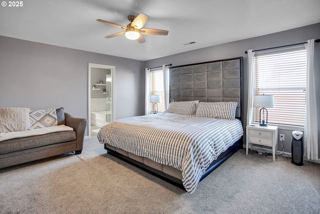 bedroom featuring visible vents, ceiling fan, carpet flooring, and ensuite bathroom