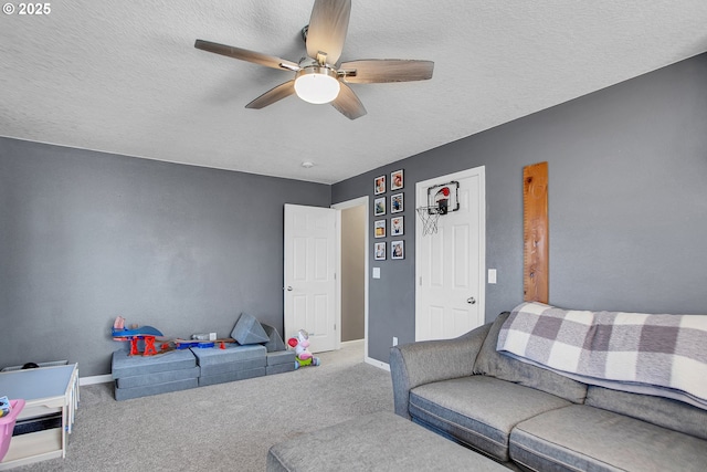 interior space featuring carpet flooring, a textured ceiling, and baseboards