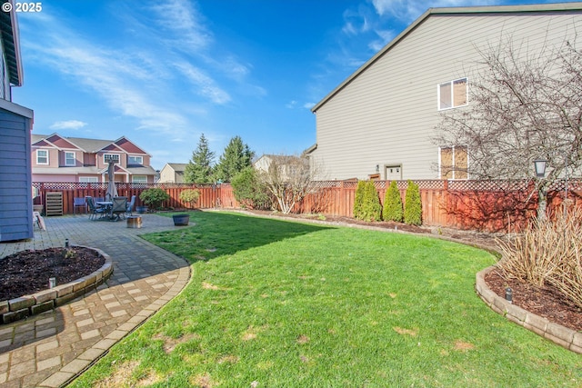 view of yard featuring a fenced backyard and a patio