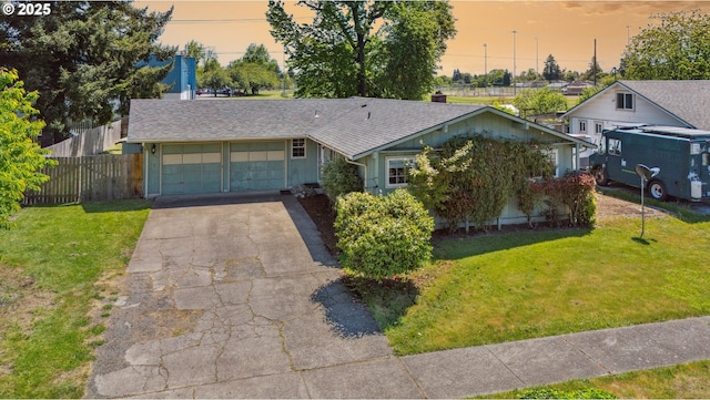 1885 N Danebo Ave, Eugene, OR 97402 - view of front facade with a garage, concrete driveway, and roof with shingles