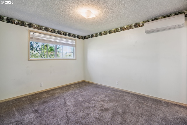1885 N Danebo Ave, Eugene, OR 97402 - carpeted empty room featuring a wall mounted AC, a textured ceiling, and baseboards