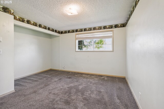 1885 N Danebo Ave, Eugene, OR 97402 - carpeted spare room featuring a textured ceiling and baseboards