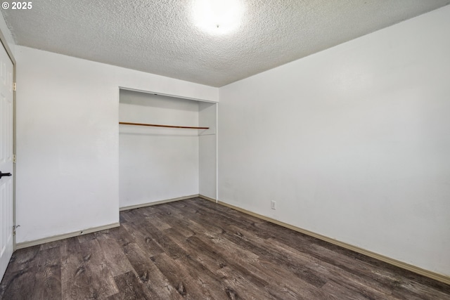 1885 N Danebo Ave, Eugene, OR 97402 - unfurnished bedroom with wood finished floors, a closet, baseboards, and a textured ceiling