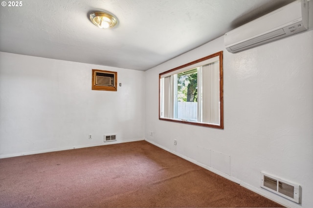 1885 N Danebo Ave, Eugene, OR 97402 - unfurnished room with a wall unit AC, carpet flooring, and baseboards