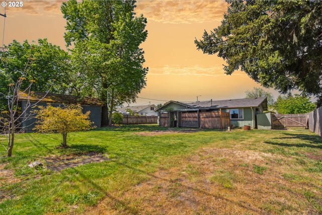 1885 N Danebo Ave, Eugene, OR 97402 - yard at dusk featuring a gate