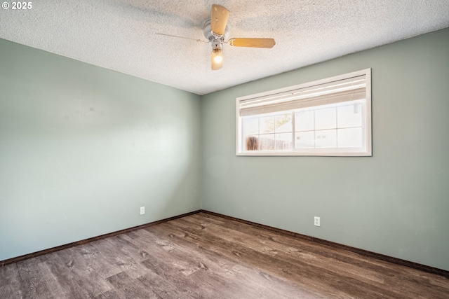 1885 N Danebo Ave, Eugene, OR 97402 - empty room featuring wood finished floors, a ceiling fan, a textured ceiling, and baseboards