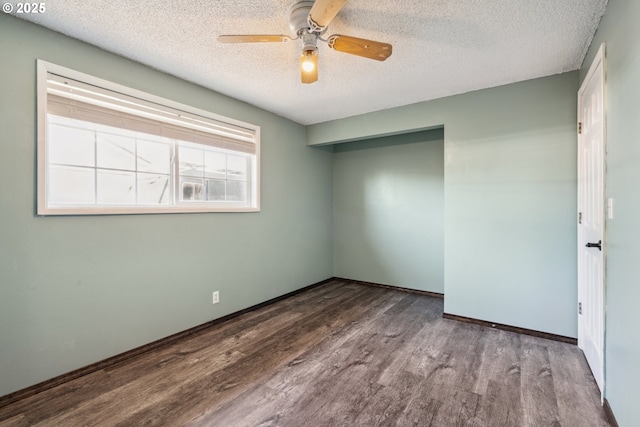 1885 N Danebo Ave, Eugene, OR 97402 - unfurnished room with wood finished floors, a textured ceiling, a ceiling fan, and baseboards